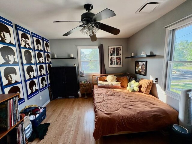 2976 Ruth Rd, Wantagh, NY 11793 - bedroom featuring light wood-style floors, multiple windows, and ceiling fan