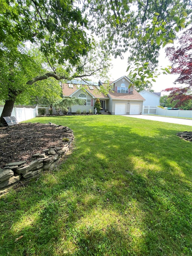 169 Woodland Dr, East Islip, NY 11730 - view of yard with driveway and an attached garage