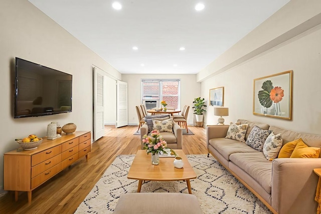 72-10 112th St Unit 5B, Forest Hills, NY 11375 - living room featuring recessed lighting, light wood-style floors, and baseboards