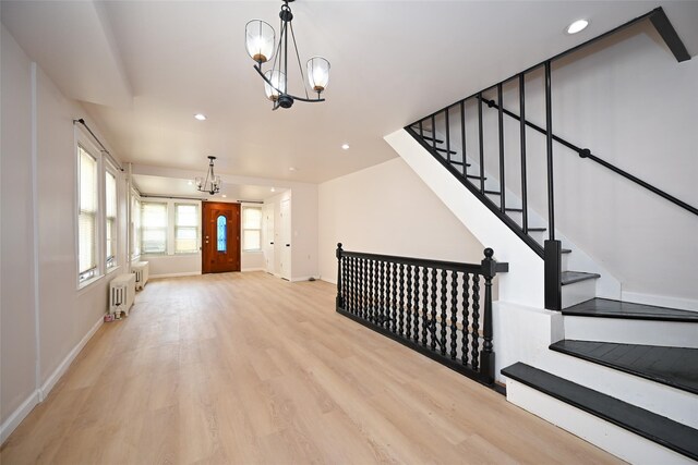 43-24 219th St, Bayside, NY 11361 - entrance foyer featuring radiator heating unit, a chandelier, wood finished floors, recessed lighting, and baseboards