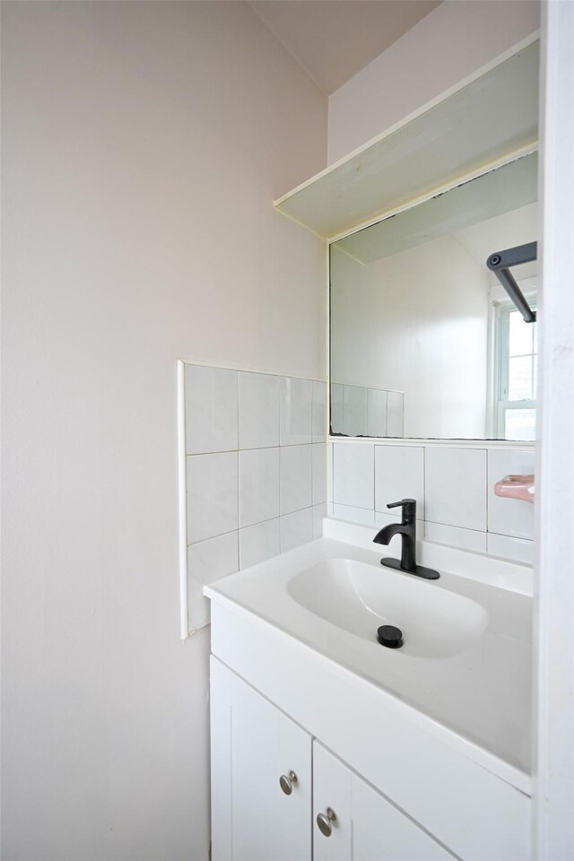43-24 219th St, Bayside, NY 11361 - bathroom with vanity, tile walls, and tasteful backsplash