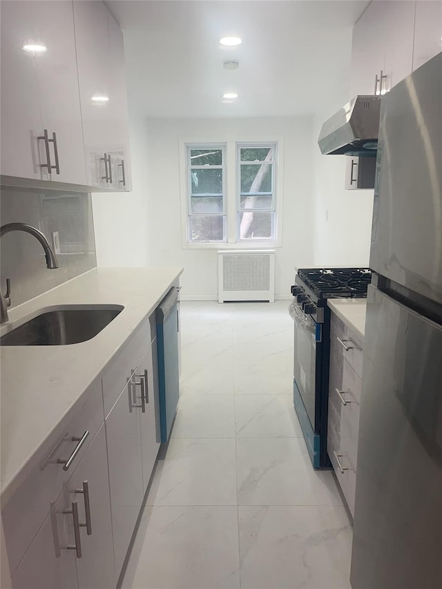 6848 Selfridge St, Forest Hills, NY 11375 - kitchen featuring radiator heating unit, appliances with stainless steel finishes, a sink, light marble finish flooring, and island exhaust hood