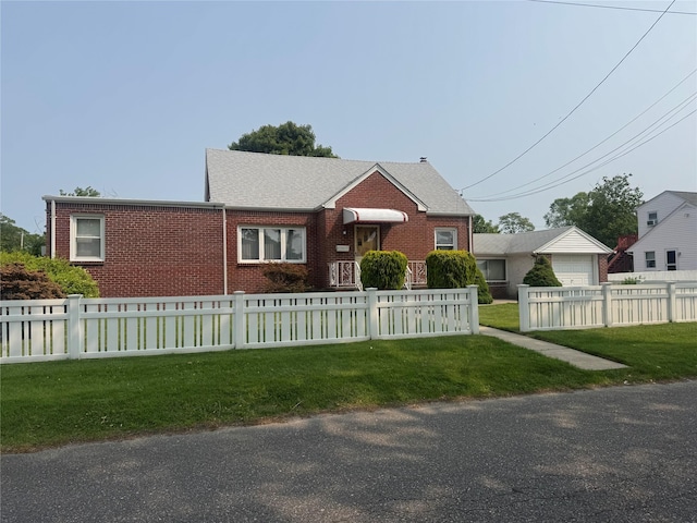 284 W Gates Ave, Lindenhurst, NY 11757 - view of front of home with brick siding and a detached garage