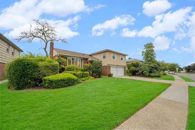 797 Caldwell Ave, North Woodmere, NY 11581 - split level home featuring a garage, brick siding, driveway, a front yard, and a chimney