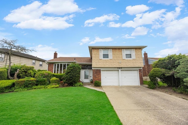 797 Caldwell Ave, North Woodmere, NY 11581 - tri-level home with brick siding, concrete driveway, and a garage