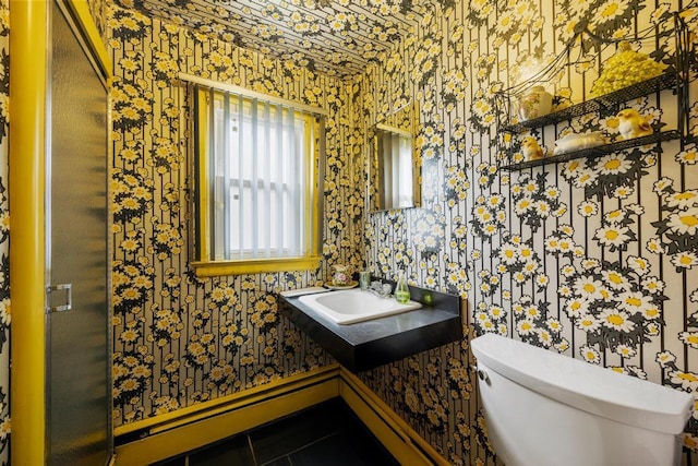 797 Caldwell Ave, North Woodmere, NY 11581 - bathroom with wallpapered walls, a sink, toilet, and tile patterned flooring
