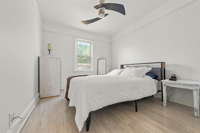 21-38 73rd St, Astoria, NY 11370 - bedroom featuring light wood-style flooring, baseboards, and a ceiling fan