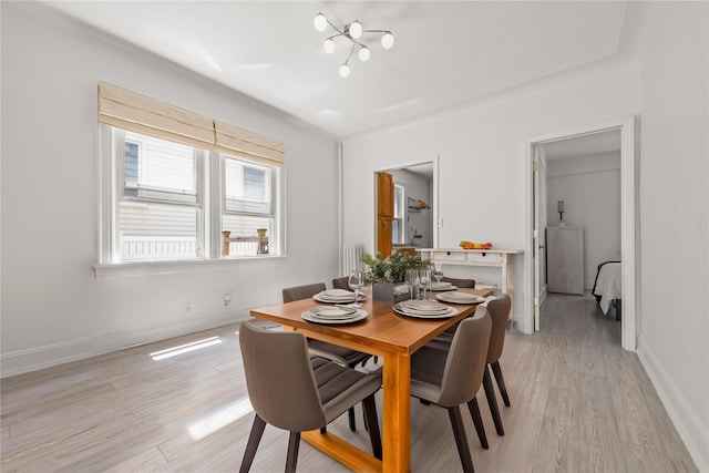 21-38 73rd St, Astoria, NY 11370 - dining room with light wood finished floors, baseboards, and a chandelier