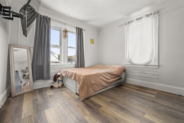 21-38 73rd St, Astoria, NY 11370 - bedroom featuring wood finished floors and baseboards