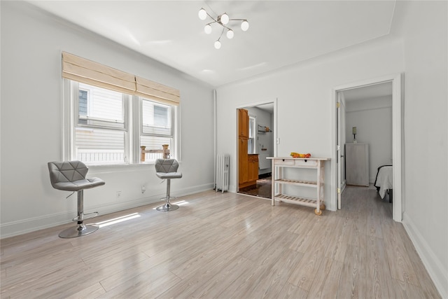 21-38 73rd St, Astoria, NY 11370 - bedroom with radiator, light wood-style flooring, and a chandelier