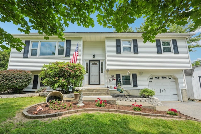 304 Cloverdale Ct, New Windsor, NY 12553 - raised ranch featuring a garage, driveway, and a front yard