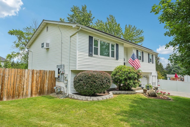 304 Cloverdale Ct, New Windsor, NY 12553 - split foyer home featuring an attached garage, concrete driveway, and a wall unit AC