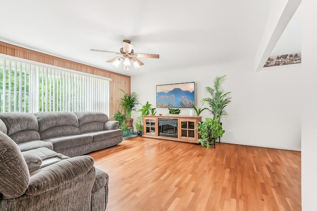 304 Cloverdale Ct, New Windsor, NY 12553 - living room with a ceiling fan, light wood finished floors, and wooden walls