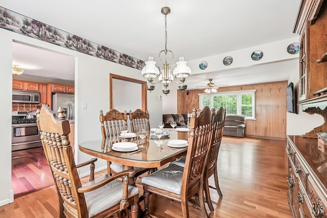 304 Cloverdale Ct, New Windsor, NY 12553 - dining space featuring light wood-style flooring, a chandelier, and ceiling fan