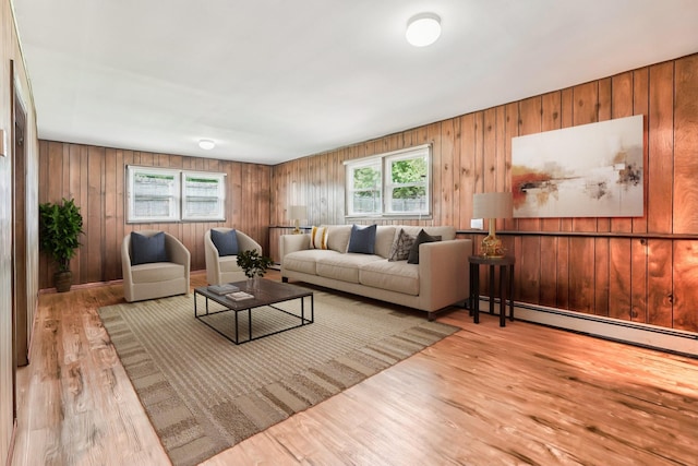 304 Cloverdale Ct, New Windsor, NY 12553 - living area featuring wood finished floors, wood walls, and a baseboard radiator