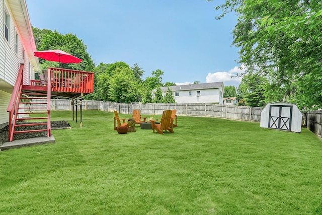 304 Cloverdale Ct, New Windsor, NY 12553 - fenced backyard with a deck, a storage unit, and stairs