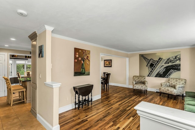 14 Troy Ct, Northport, NY 11768 - living area with crown molding, baseboards, and wood finished floors