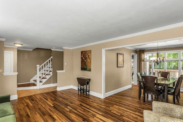 14 Troy Ct, Northport, NY 11768 - dining space with dark wood-style floors, a chandelier, stairs, ornamental molding, and baseboards