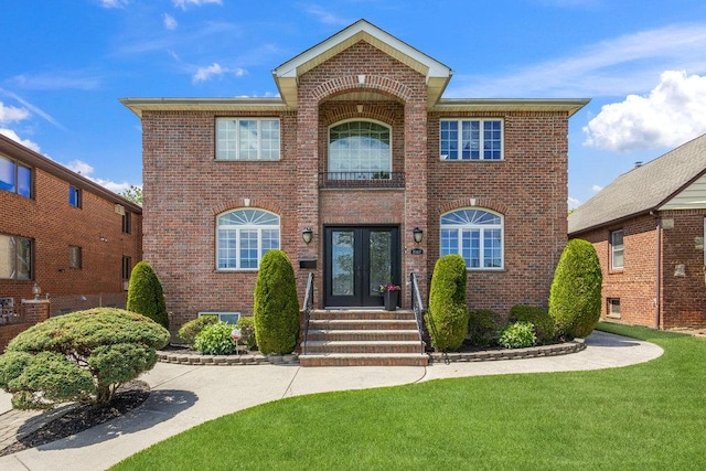 20407 29th Ave, Bayside, NY 11360 - view of front of property with french doors, brick siding, and a front yard
