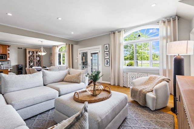 20407 29th Ave, Bayside, NY 11360 - living room with light wood-style floors, crown molding, and recessed lighting