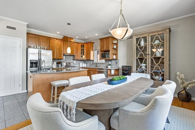 20407 29th Ave, Bayside, NY 11360 - dining area with ornamental molding, recessed lighting, and baseboards