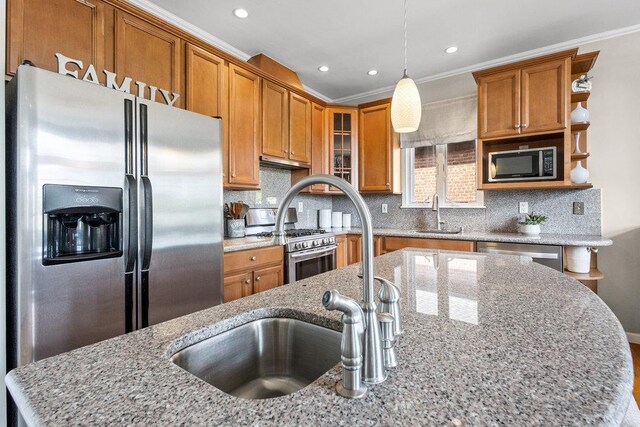 20407 29th Ave, Bayside, NY 11360 - kitchen with appliances with stainless steel finishes, a sink, brown cabinetry, glass insert cabinets, and pendant lighting