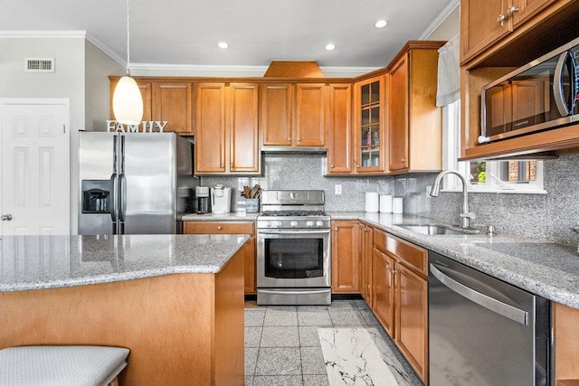 20407 29th Ave, Bayside, NY 11360 - kitchen with appliances with stainless steel finishes, ornamental molding, a sink, granite floors, and brown cabinets