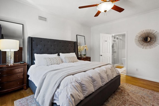 20407 29th Ave, Bayside, NY 11360 - bedroom with wood finished floors, crown molding, baseboards, ensuite bath, and ceiling fan