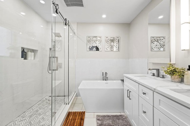 20407 29th Ave, Bayside, NY 11360 - bathroom featuring a soaking tub, a shower stall, double vanity, recessed lighting, and tile patterned flooring