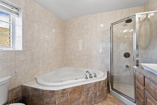 20407 29th Ave, Bayside, NY 11360 - full bathroom featuring a tub with jets, a stall shower, tile walls, toilet, and vanity