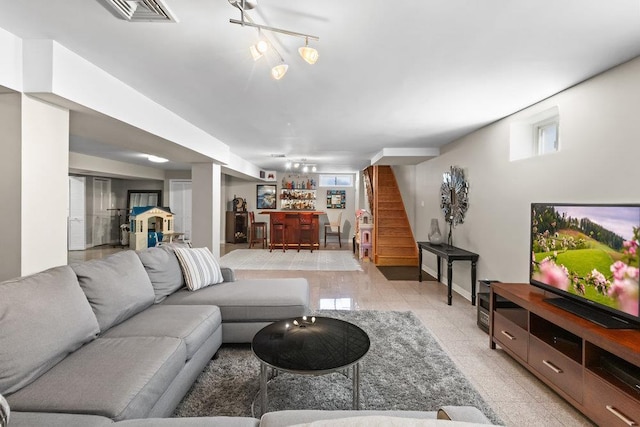 20407 29th Ave, Bayside, NY 11360 - living area featuring a bar, rail lighting, and stairs