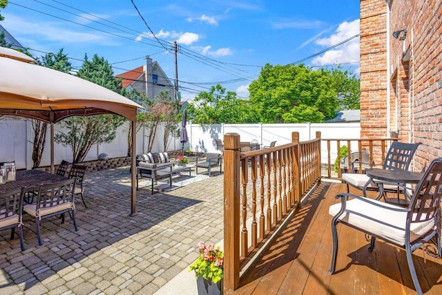 20407 29th Ave, Bayside, NY 11360 - fenced backyard with a gazebo, a patio area, outdoor dining area, and an outdoor living space