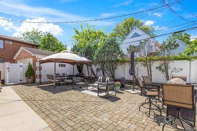 20407 29th Ave, Bayside, NY 11360 - fenced backyard featuring outdoor dining space, a gate, a patio area, a gazebo, and an outdoor hangout area