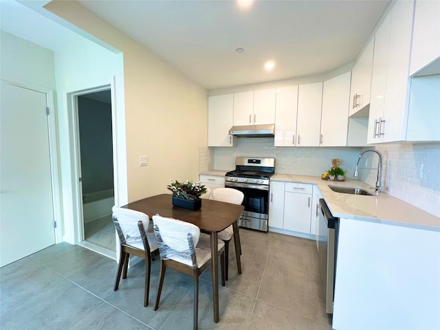 150-23 Barclay Ave Unit 3H, Flushing, NY 11355 - kitchen featuring appliances with stainless steel finishes, a sink, under cabinet range hood, and white cabinets
