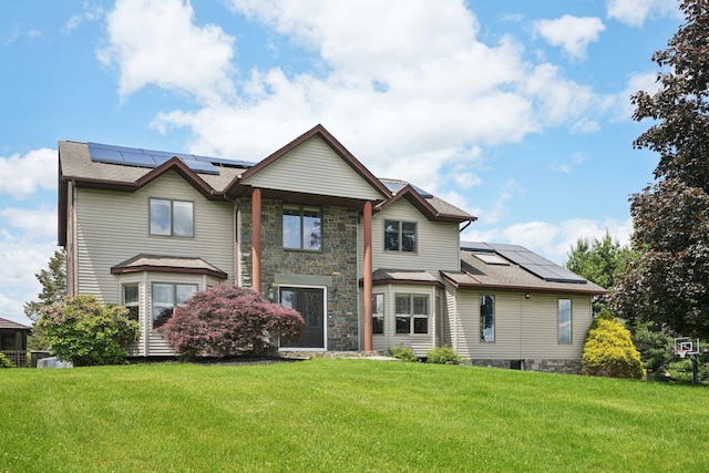 30 Sunrise Rdg, Florida, NY 10921 - back of house with roof mounted solar panels, a yard, and stone siding