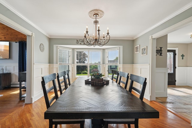30 Sunrise Rdg, Florida, NY 10921 - dining area with a chandelier, a baseboard heating unit, light wood finished floors, wainscoting, and a decorative wall