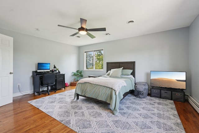 30 Sunrise Rdg, Florida, NY 10921 - bedroom featuring wood finished floors, ceiling fan, baseboard heating, baseboards, and an office area