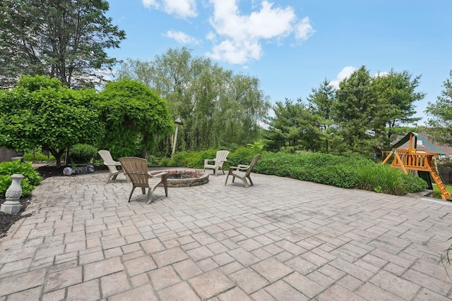 30 Sunrise Rdg, Florida, NY 10921 - view of patio / terrace featuring a fire pit, a playground, and view of wooded area