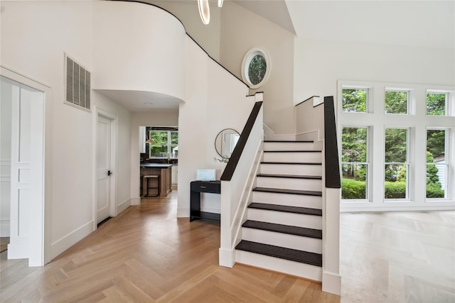 3 Sugar Maple Ct, Dix Hills, NY 11746 - staircase with a high ceiling and arched walkways