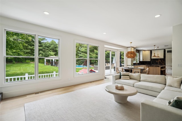 3 Sugar Maple Ct, Dix Hills, NY 11746 - living area with healthy amount of natural light, light wood-style flooring, and recessed lighting