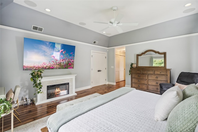 3 Sugar Maple Ct, Dix Hills, NY 11746 - bedroom with wood finished floors, recessed lighting, a glass covered fireplace, and ceiling fan