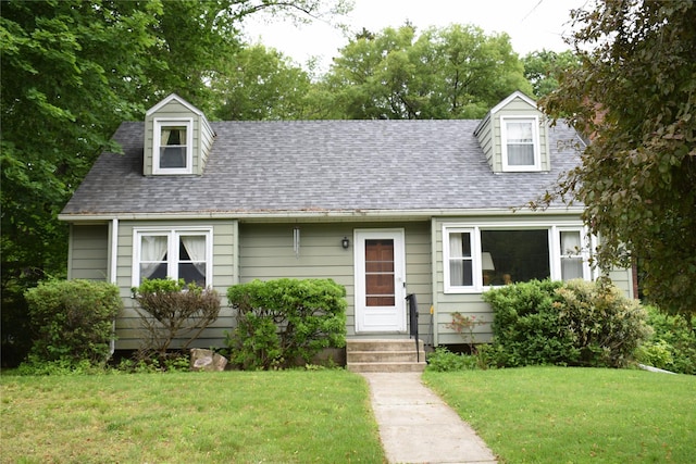 25 Alda Dr, Poughkeepsie, NY 12603 - cape cod home featuring a front yard and a shingled roof