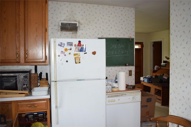25 Alda Dr, Poughkeepsie, NY 12603 - kitchen featuring white appliances, wallpapered walls, brown cabinets, and light countertops