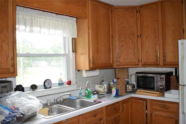 25 Alda Dr, Poughkeepsie, NY 12603 - kitchen featuring stainless steel microwave, light countertops, plenty of natural light, and a sink