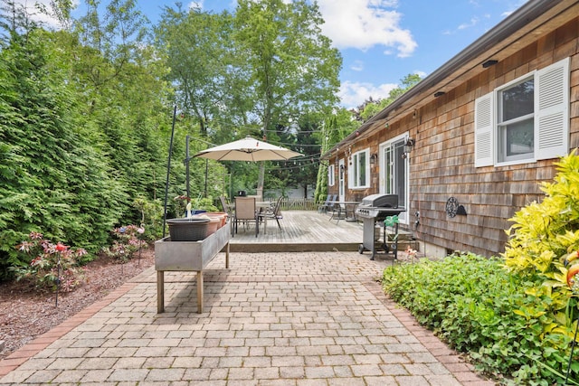 8 Jackson Ave, Hampton Bays, NY 11946 - view of patio / terrace with outdoor dining area, a deck, and a grill