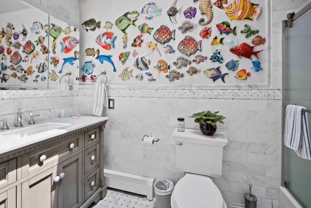 8 Jackson Ave, Hampton Bays, NY 11946 - bathroom featuring baseboard heating, tile walls, vanity, a shower with door, and toilet