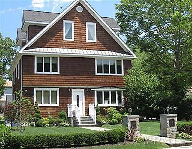 2 Goldwin St, Rye, NY 10580 - shingle-style home featuring a front lawn
