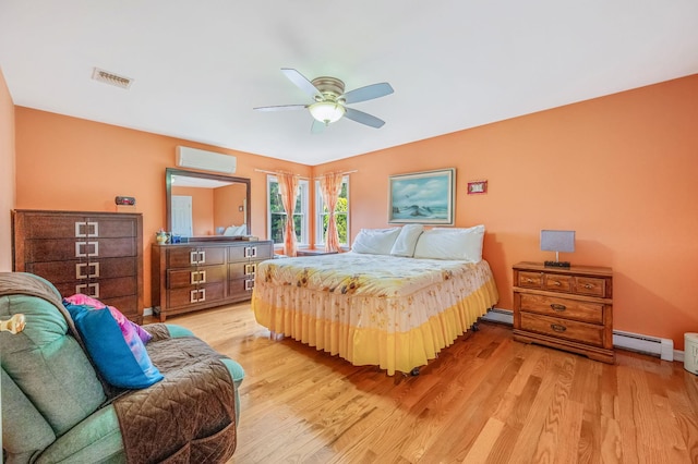320 Williams Way S, Baiting Hollow, NY 11933 - bedroom with light wood finished floors, baseboard heating, and ceiling fan