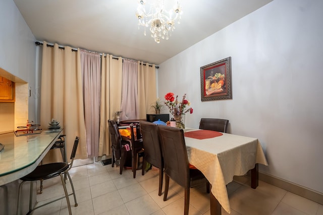 32-23 76th St, East Elmhurst, NY 11370 - dining area featuring a chandelier and light tile patterned flooring