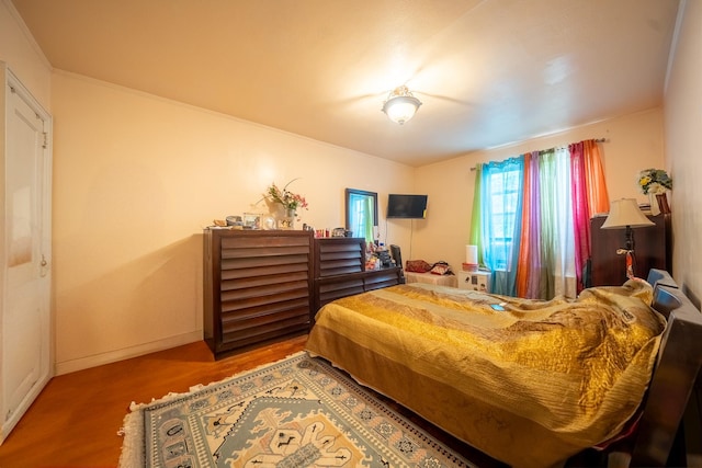 32-23 76th St, East Elmhurst, NY 11370 - bedroom featuring wood finished floors and baseboards